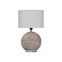 Ceramic round table lamp with a natural unbleached linen fabric shade.