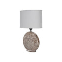 Ceramic round table lamp with a natural unbleached linen fabric shade.